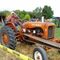 Vern, running the tractor for the threshing machine. Please see the movies of the threshing.